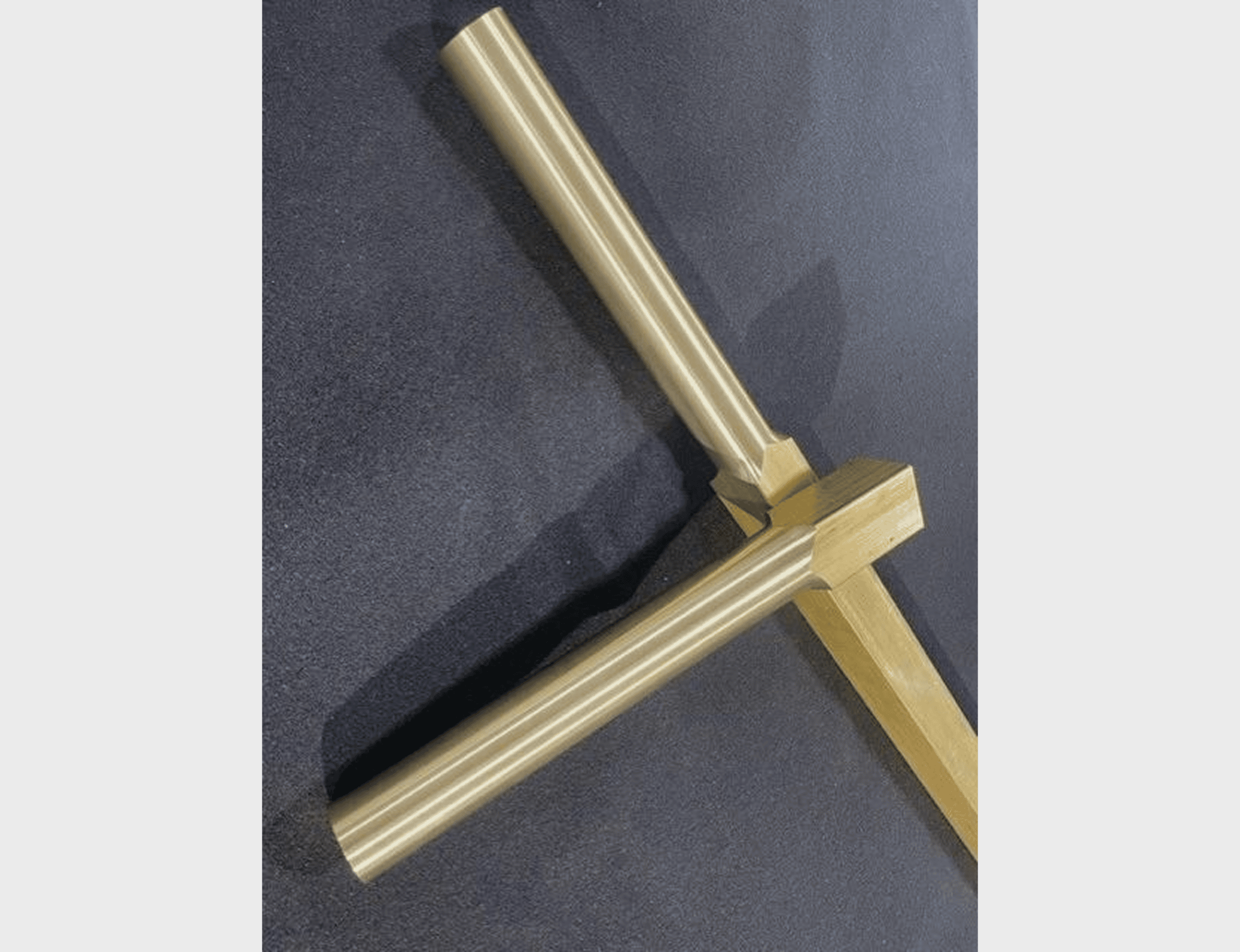 Metallic rods intersecting at right angle.