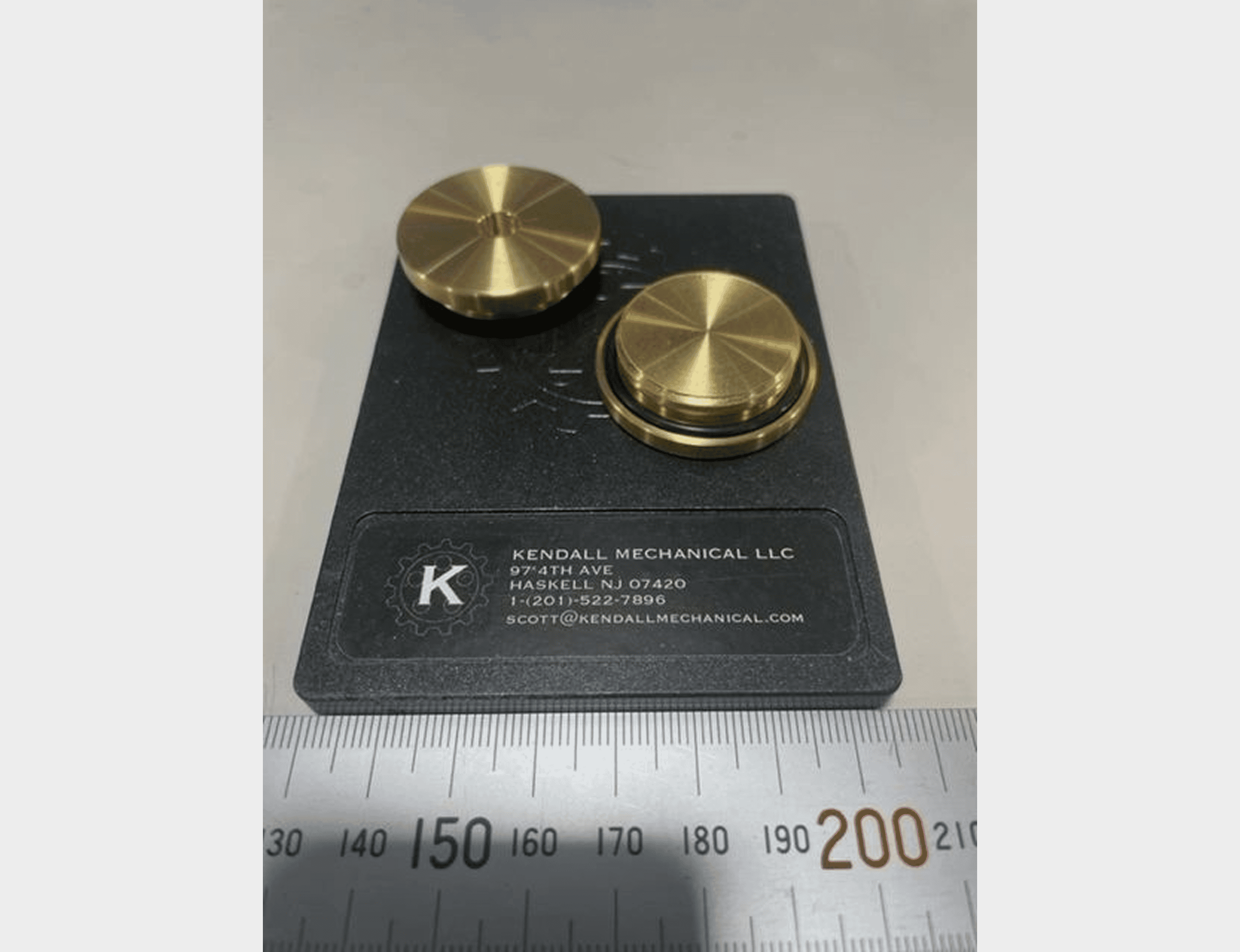 Gold knobs on a business card.