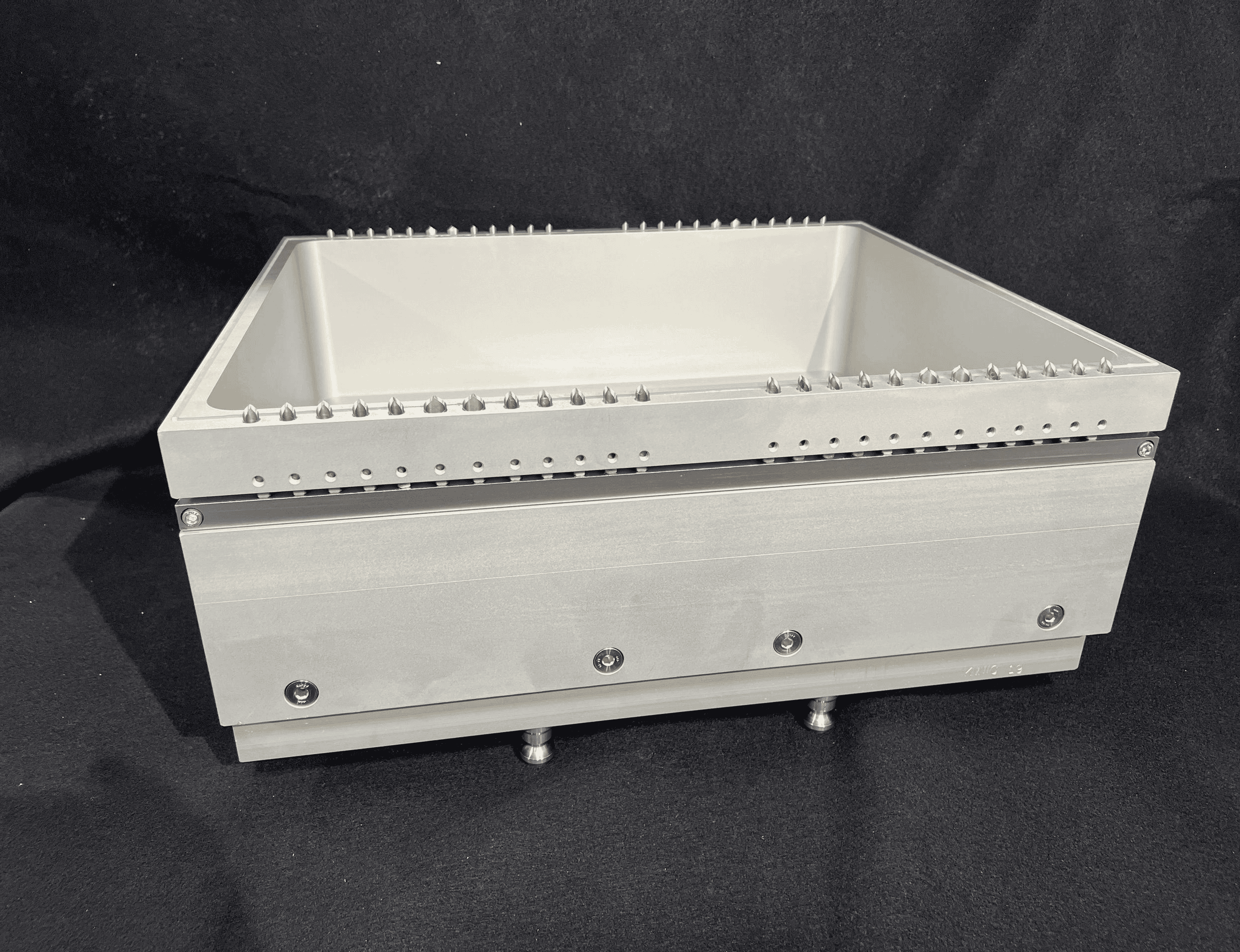 Metallic rectangular box on dark background.